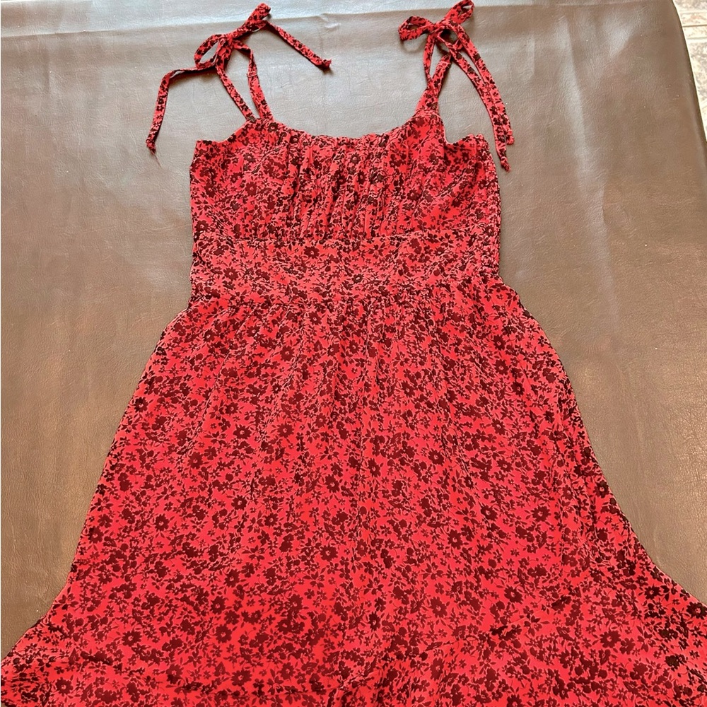 Girls small red dress with black flower print. Lily Rose